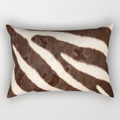 a brown and white zebra print rectangular pillow