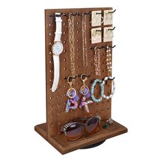 a wooden display with sunglasses and jewelry on it