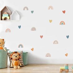 a child's room with rainbows and hearts on the wall