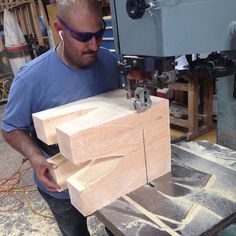 a man working with wood in a shop