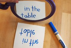 two pieces of paper that say in the table