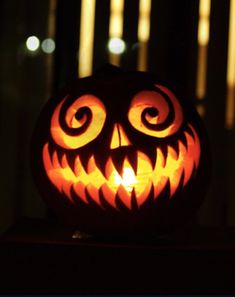 a carved jack o lantern sitting on top of a table