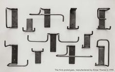 several metal brackets are arranged on a white background with black text that reads first set of hooks, manufactured by person in 1915