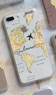 an iphone case with a world map on it and the word, laura written in cursive writing