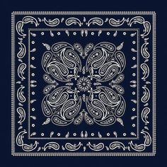 a blue bandanna with an ornate design on it, in the shape of a flower