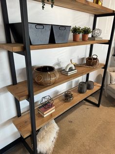 a shelf with some plants and other items on it