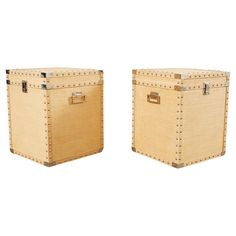 two wooden trunks with rivets are shown side by side on a white background