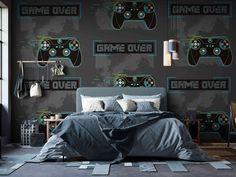 a bed room with a neatly made bed and game over wallpaper on the walls