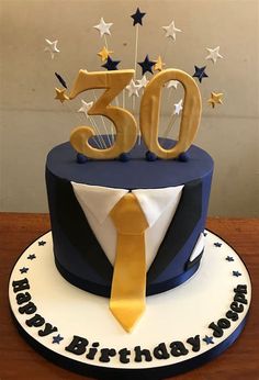 a blue and white birthday cake with the number 50 on it's top tier