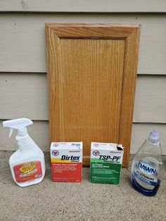 the contents of a disinfective cleaning kit sitting next to a wooden door