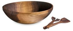 a wooden bowl and two spoons on a white background