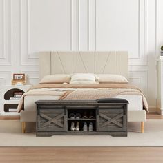 a bedroom with a bed, nightstands and shoes on the bottom shelf in front of it