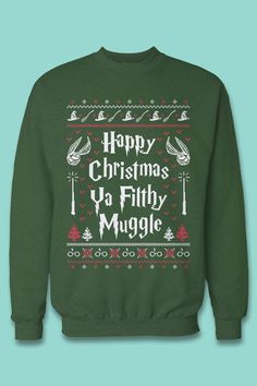 a green christmas sweater with the words happy christmas ya filthy muggle in white on it