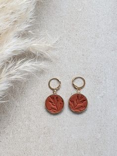 Terra Cotta-colored "Hawthorn" earrings with gold clip. Handmade artisan jewelry. Very light and pleasant to wear earrings. Handmade Artisan Rust Earrings, Rustic Brass Drop Earrings, Artisan Brass Drop Earrings, Raw Brass Earrings, Terracotta Earings, Gold Clips, Jewelry Hand, Terra Cotta