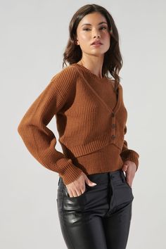 Day date, grocery shopping, farmer's market, this cardi is all you're going to want to live in. It highlights an easy-to-wear fit with long balloon sleeves. It has a simple button front feature that leads to a cropped sweep. Wear it over the matching tank or your favorite midi dress for warmth.- Ribbed knit- Button front- Cropped- Classic fit- Color: ChocolateSize + Fit - Model is 5'8" and wearing size XS- Measurements taken from size S - Chest: 35"- Length: 16 3/4" Fabric Self: 56% Viscose, 27% Brown Ribbed Cardigan For Work, Brown Ribbed Outerwear For Fall, Brown Fall Cardigan, Brown Sweater For Layering With Button Closure, Brown Button-up Sweater For Layering, Brown Button-up Cardigan For Fall, Long Balloons, Farmer's Market, Grocery Shopping