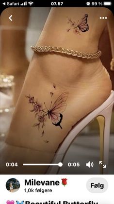 a person with tattoos on their legs and feet, showing the butterfly tattoo design in front of them