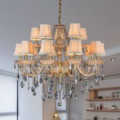 a chandelier hanging from the ceiling in a living room