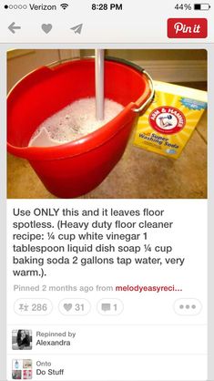 a red bucket filled with white stuff sitting on top of a counter