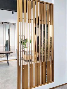 a room divider made out of wooden slats