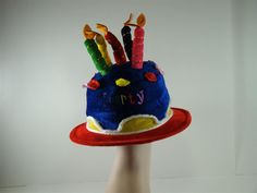 This colorful, unisex hat is the perfect accessory for that special someones birthday! Full of primary colors and and candles extending off the top and embroidered "Party", it is a wonderful way to celebrate that special person! Hat comes in several color options One Size Fits Most 6" Wide Available individually, 3-Pack, 6-Pack, & 12-Pack pricing Fun Costume Hats For Birthday, Fun Hats For Birthday And Carnival, Playful Hats For Birthday And Carnival, Fun Carnival Birthday Hats, Fun Birthday Carnival Hats, Fun Costume Hats And Headpieces For Birthday Carnival, Fun Mini Hats For Birthday Carnival, Playful Mini Hats For Birthday And Carnival, Playful Mini Hats For Birthday Carnival