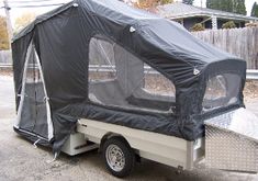 a trailer with a tent attached to it