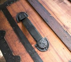 an old wooden trunk with metal handles