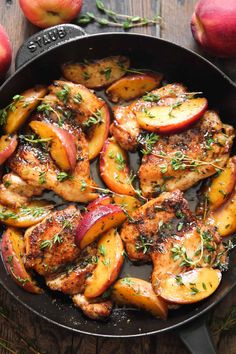 chicken and apples in a skillet with herbs