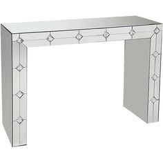 a mirrored console table with an intricate design