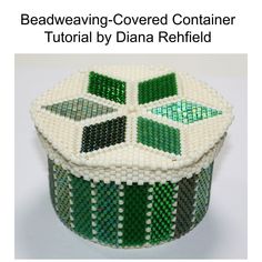 beading covered container with green and white designs