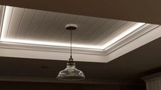 a light fixture hanging from the ceiling in a room