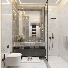 a modern bathroom with marble walls and flooring