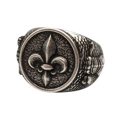 Fleur de Lys signet bronze ring Introducing the Fleur de Lys Knight Ring, an exquisite piece of historical jewelry that embodies the essence of medieval chivalry and heraldry. This men's signet ring is perfect for those who appreciate the timeless elegance of knight jewelry and the rich symbolism of the Fleur de Lys.Design: The ring features the iconic Fleur de Lys, a symbol of nobility and purity, prominently displayed as a coat of arms. Material: Crafted with meticulous attention to detail, th Vintage Silver Signet Ring With Antique Finish, Antique Engraved Silver Signet Ring, Medieval Engraved Signet Ring Gift, Antique Engraved Signet Ring In Silver, Medieval Engraved Signet Ring For Gift, Vintage Engraved Antique Silver Signet Ring, Vintage Engraved Metal Signet Ring, Antique Silver Signet Ring In Brass, Medieval Bronze Jewelry With Antique Finish