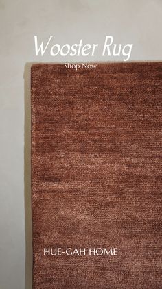 the rug is brown and has words on it that read, wooster rug shop now hue - cah - home