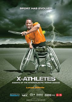 a man in a wheelchair holding a tennis racquet on top of a field