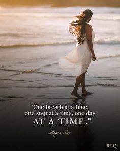 a woman walking on the beach with her hair blowing in the wind and an inspirational quote