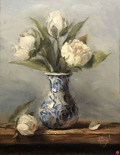 a painting of white flowers in a blue and white vase on a wooden table top