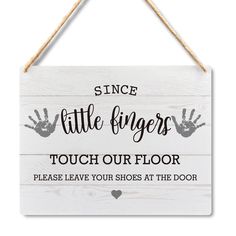 a sign that says, since little fingers touch our floor please leave your shoes at the door