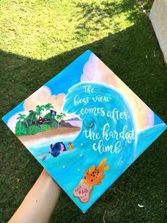 someone is holding up a graduation cap that says the best view comes after the faraway end