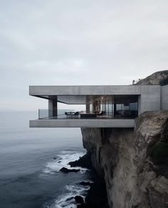 a house on the cliff overlooking the ocean