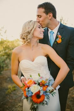 a bride and groom pose for a wedding photo