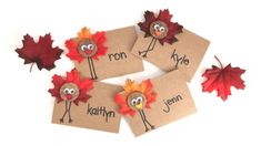 four thanksgiving place cards with turkeys and leaves on them