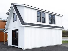 a white house with black trim and windows