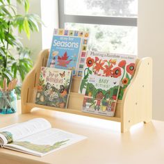 a wooden desk with books on it