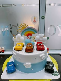 a birthday cake with cars on it