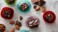 assorted chocolates and nuts on a marble surface