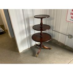 three tiered cake stand sitting in front of a door