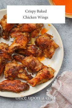 crispy baked chicken wings on a white plate