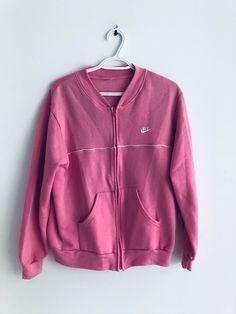 pink vintage nike sweatshirt.  Size:  pit to pit: 22" neck to bottom: 25" collar to cuff: 29" Pink Cotton Sweatshirt With Ribbed Collar, Pink Crew Neck Sweatshirt With Ribbed Collar, Pink Ribbed Collar Crew Neck Sweatshirt, Pink Sweatshirt With Ribbed Collar For Spring, Pink Cotton Sweater With Ribbed Collar, Pink Long Sleeve Sweatshirt With Ribbed Cuffs, Casual Pink Fleece Sweater, Casual Pink Sweats For Sports, Pink Casual Sweats For Sports