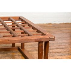 a wooden table sitting on top of a hard wood floor