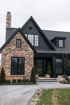 a large brick house with lots of windows